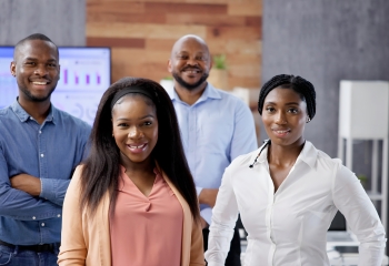 Happy group of business people standing in an office