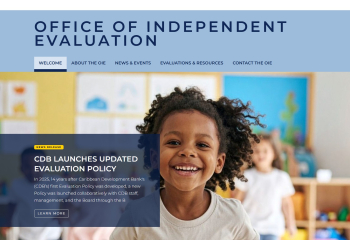 Website homepage for the Office of Independent Evaluation showing navigation tabs and a banner announcing the Caribbean Development Bank’s updated evaluation policy, with an image of a child in a classroom.