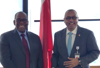 Mr. Alexander Augustine, CDB Portfolio Manager, and Dr. The Honourable Kennedy Swaratsingh, Minister of Planning, Economic Affairs and Development, Trinidad and Tobago, pose for a photo during a meeting.