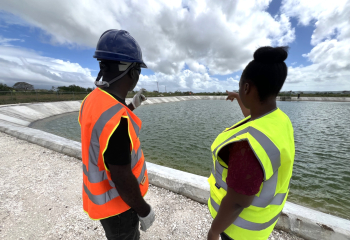 Southern Plains Agricultural Development (SPAD) Project team members observe reservoir delivered under the initiative.