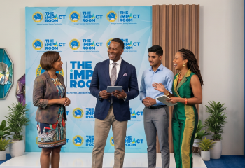Group of smiling business people mingle in business space