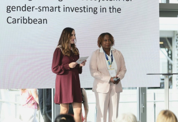 Two professional women standing on stage 