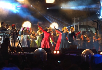 Haitian dancers on stage performing in front of audience