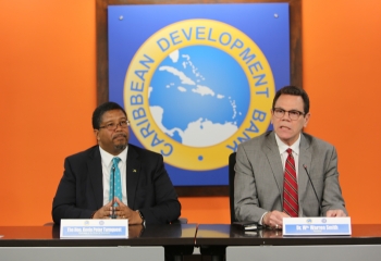 Deputy Prime Minister of The Bahamas and Chairman of CDB’s Board of Governors, the Hon. Kevin Peter Turnquest (l.) and CDB President Wm. Warren Smith