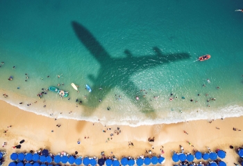plane shadow over beach
