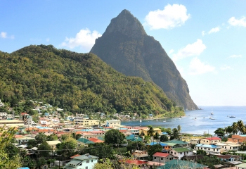 Aerial view of the small town Soufriere in Saint Lucia with The Pitons in the distance