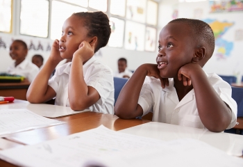 Stock image of school children listening