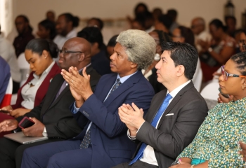 Audience at the launch of the YEA function seated and clapping 