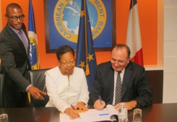 CDB VP Mckenzie signs agreement with AFD