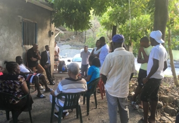 community meeting under the tree