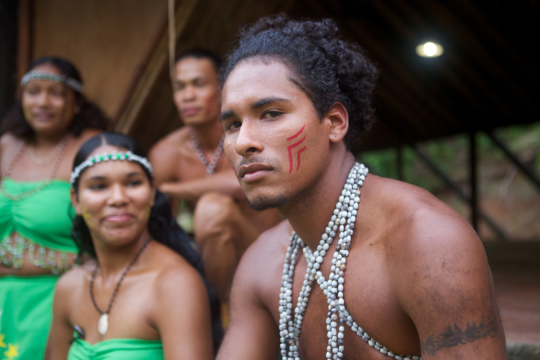 indigenous male looking into camera